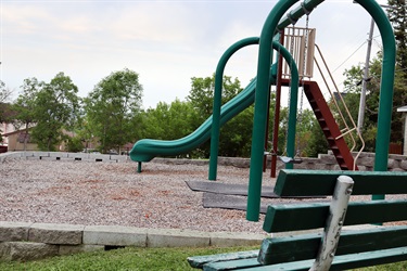 Bench and playground equipment at Peanut Park.