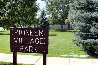 Wood sign at Pioneer Village Park.